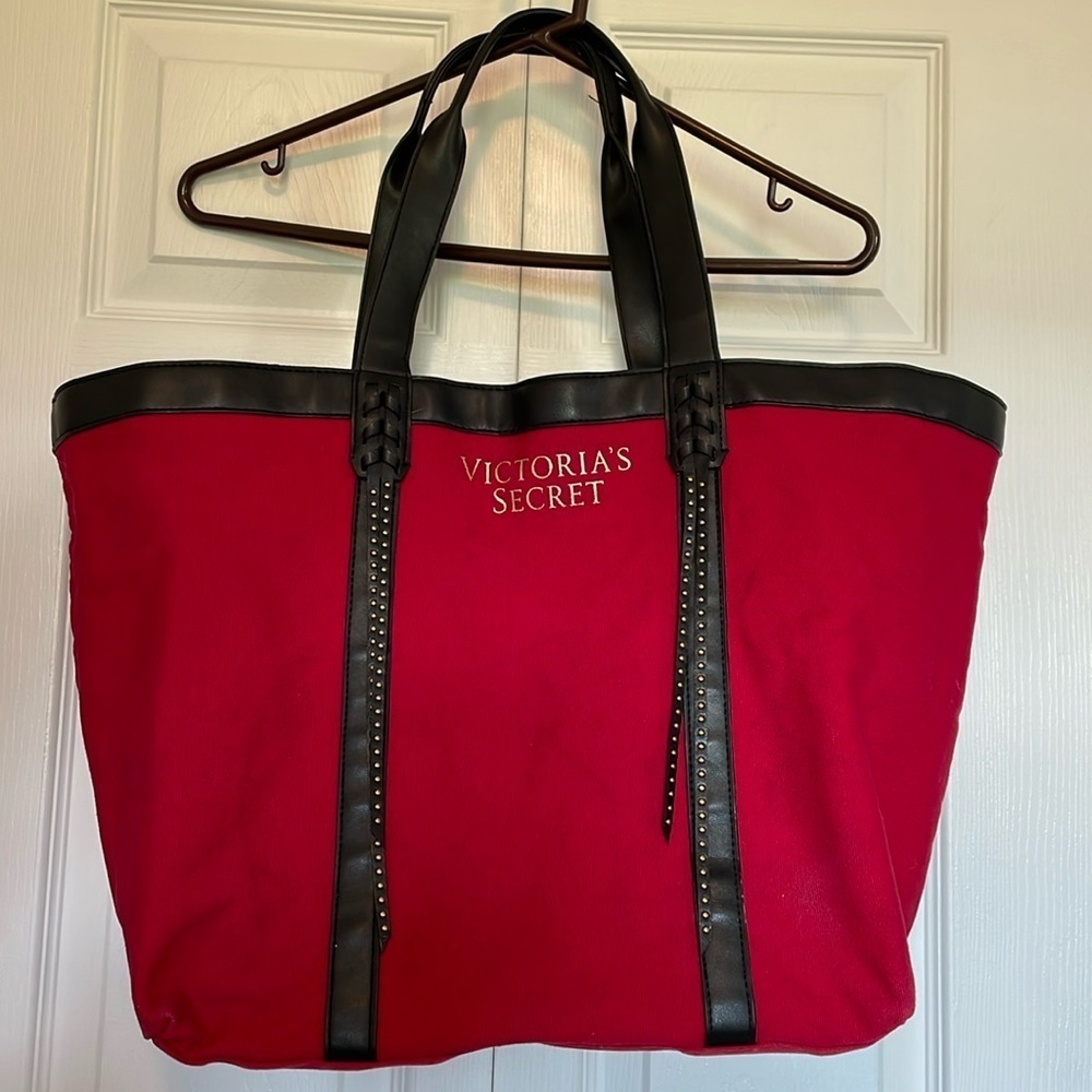 Victoria Secret red canvas tote with faux leather trim/ straps. Stud detail Moto